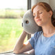Woman On Train With Mini Desk & Travel Pillow.
