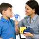 Child and mom using the nebulizer kit.