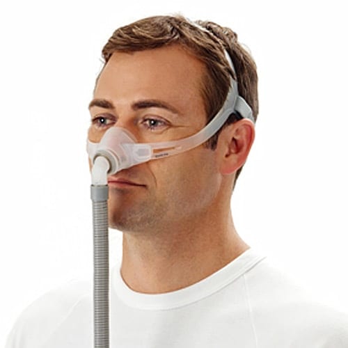 Man wearing a Swift FX Nano nasal CPAP mask