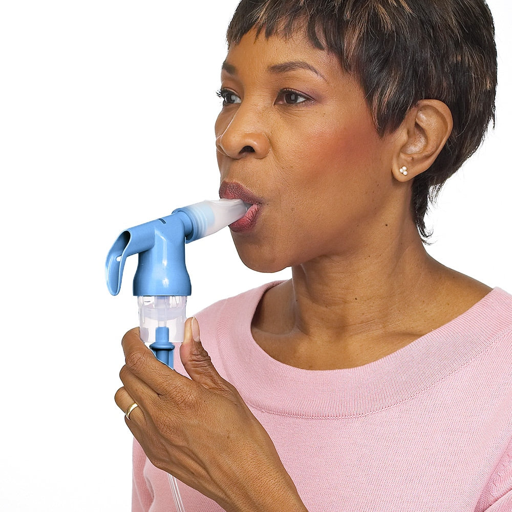 Woman using reusable nebulizer.