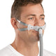 man wearing Resmed Swift FX Bella nasal pillow mask with bella loops